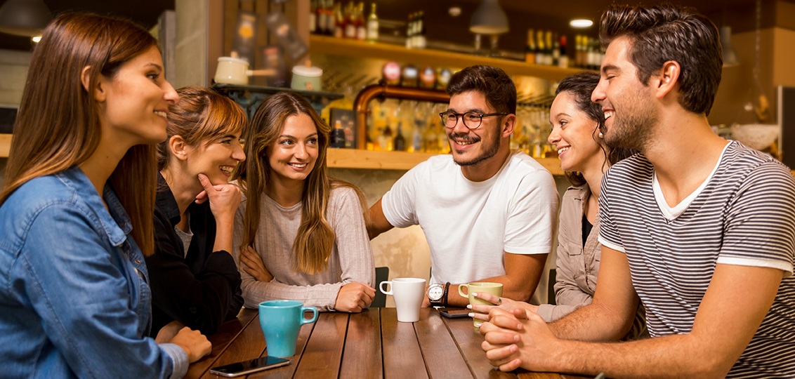 Gen Z Market Research, group of friends talking and drinking coffee at the cafe