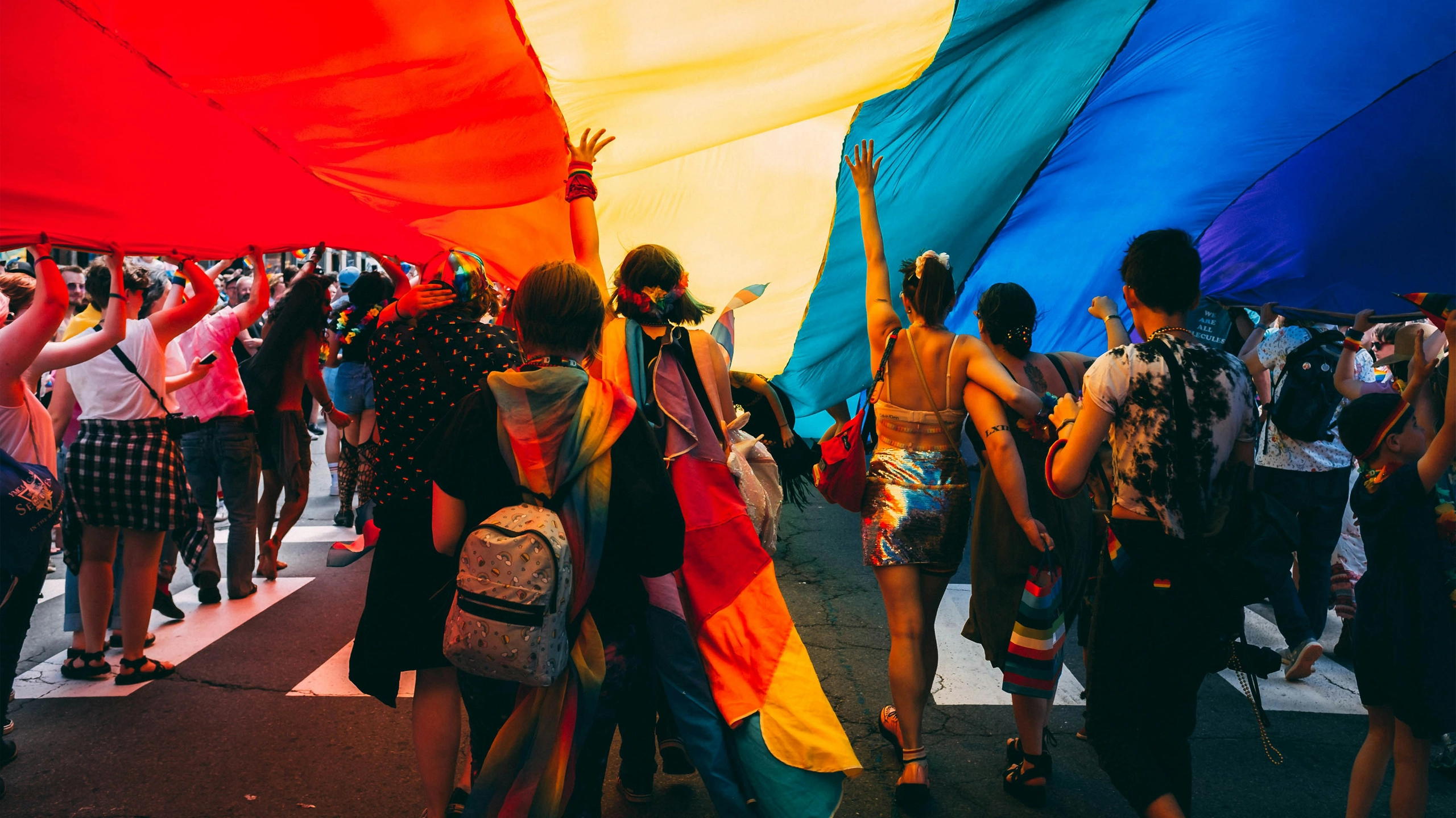 LGBTQ+ in an event holding flag